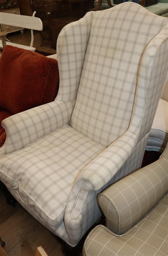 An early 20th century Queen Anne style upholstered wing armchair